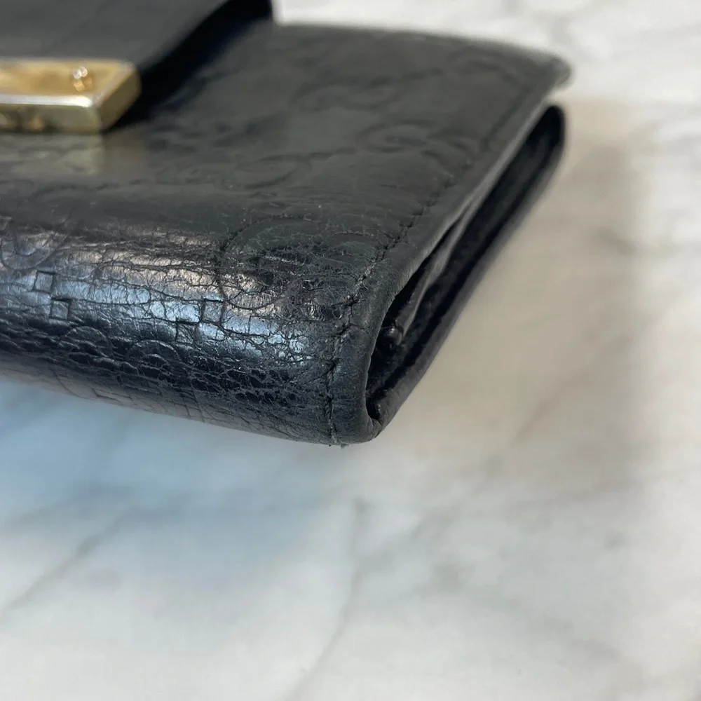 Gucci Black Embossed GG Leather Wallet with Gold Nameplate